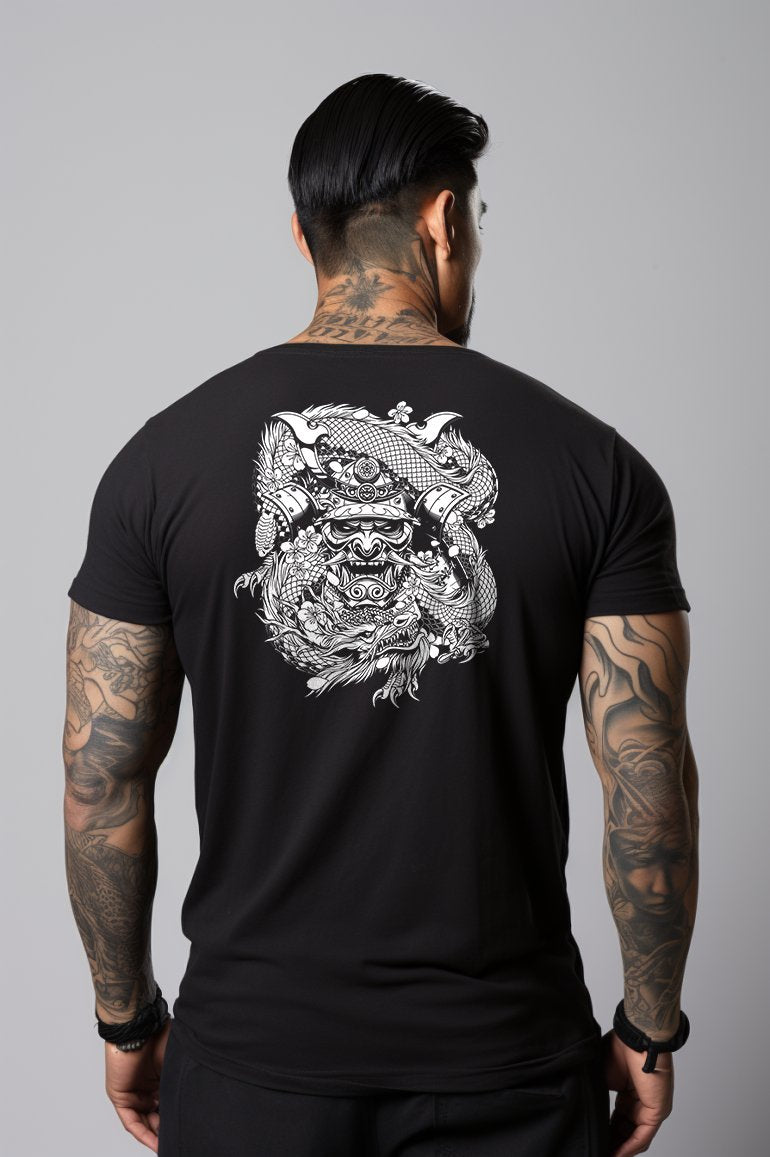 man wearing a black t shirt with a large image of a samurai mask and a dragon weaving around it on the back