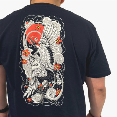 Back view of a Navy T-shirt featuring a Japanese Irezumi tattoo-inspired graphic of a crane surrounded by floral and wave motifs. Text overlay reads 'Irezumi Inspired Tattoo Tees - Our graphic tees blend traditional tattoo art with modern aesthetics.