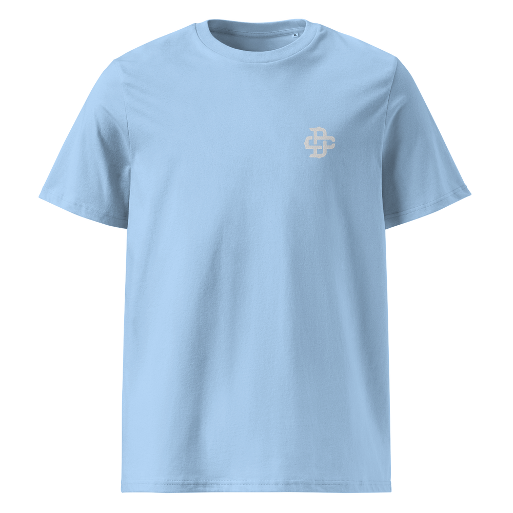 Front view of a light blue t-shirt featuring a subtle left chest DC embroidery logo. Premium organic cotton with a minimalist streetwear design.