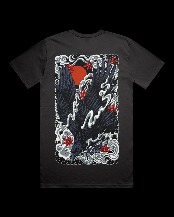 Irezumi inspired graphic print of a decending crow with clouds against a red sun large on the back of a coal t shirt