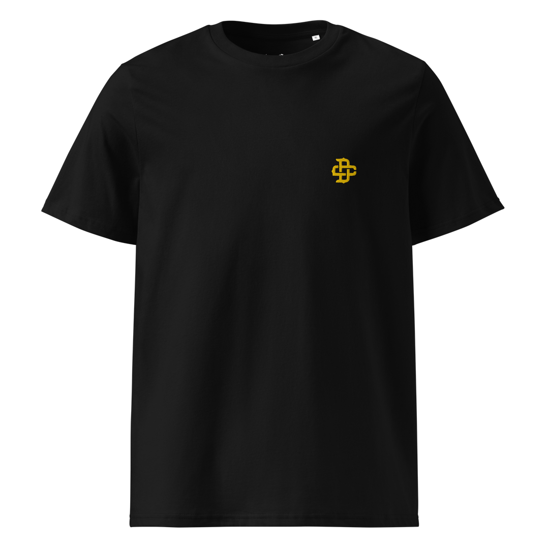 front product shot of a black tee showing the DC monogram logo embroidered on the left chest in yellow