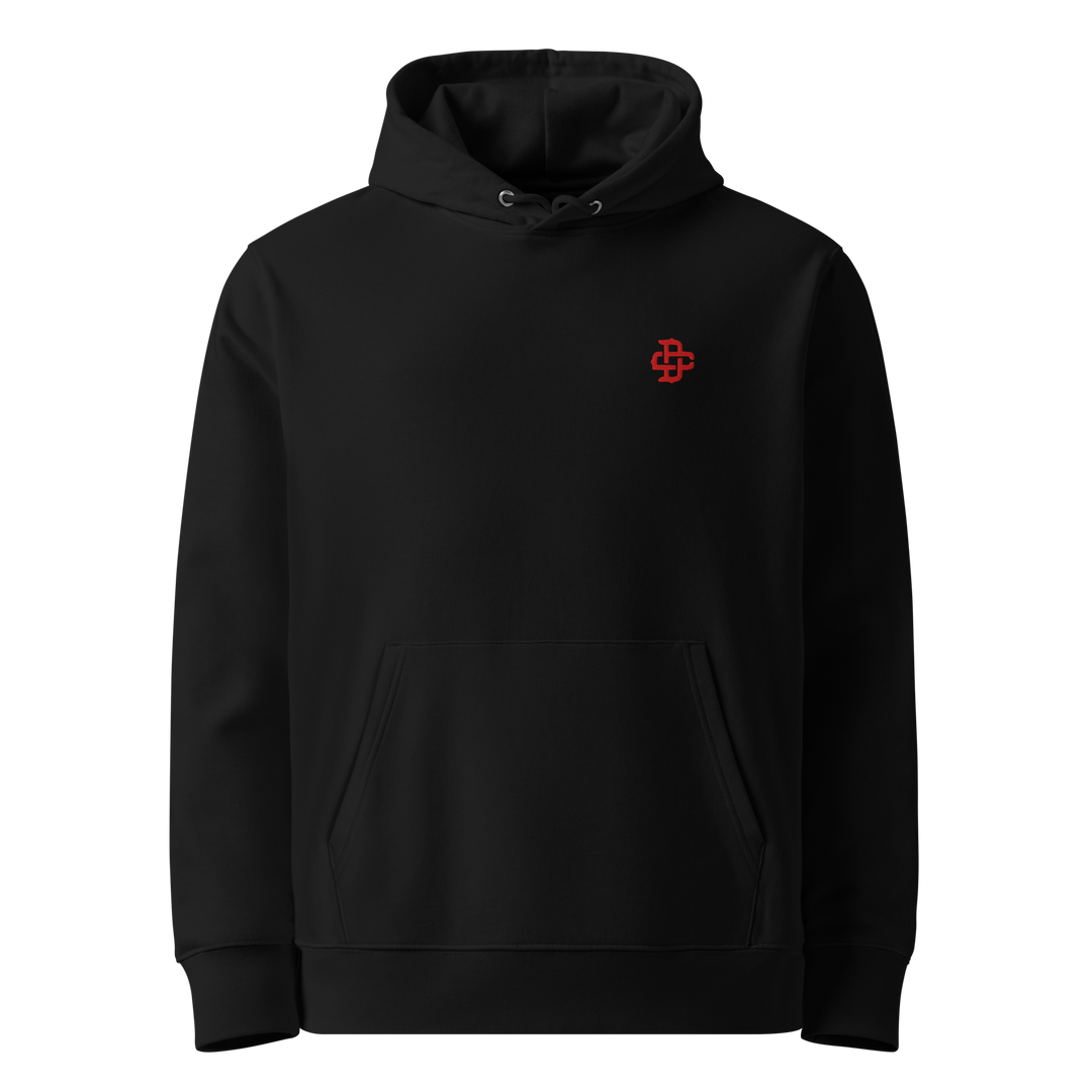 Product mockup of the front view of a premium black hoodie with the DC monogram embroidered in red on the left chest