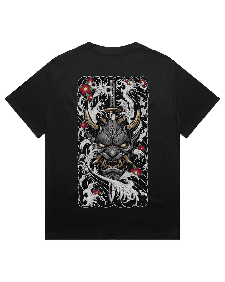 A black short-sleeve oversized t-shirt with a large rectangular graphic print on the front featuring a Japanese-style horned demon face surrounded by white waves and red flowers.