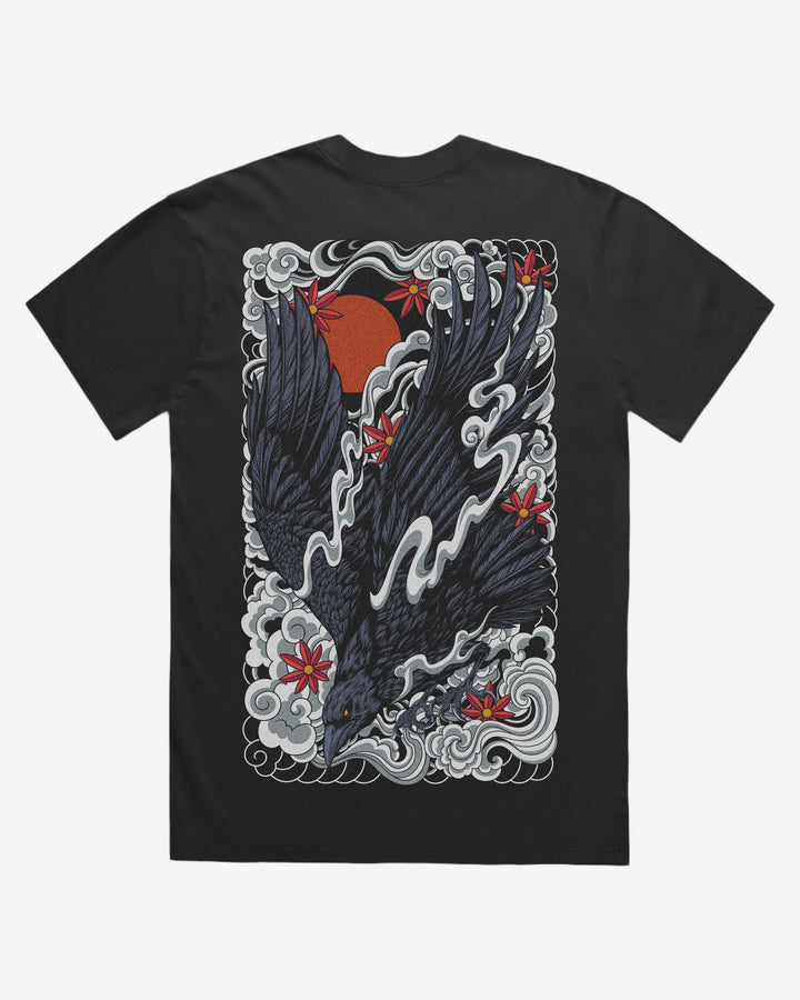 faded black graphic t-shirt with a raven and irezumi clouds design on the back against a white background