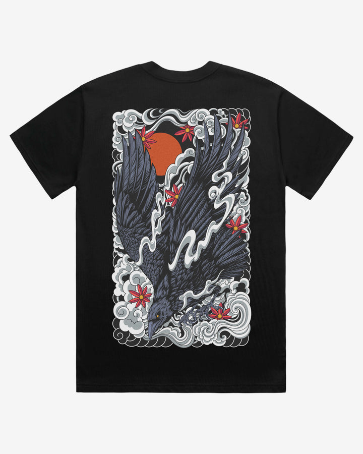 Black t-shirt with a design of a raven and clouds on a white background