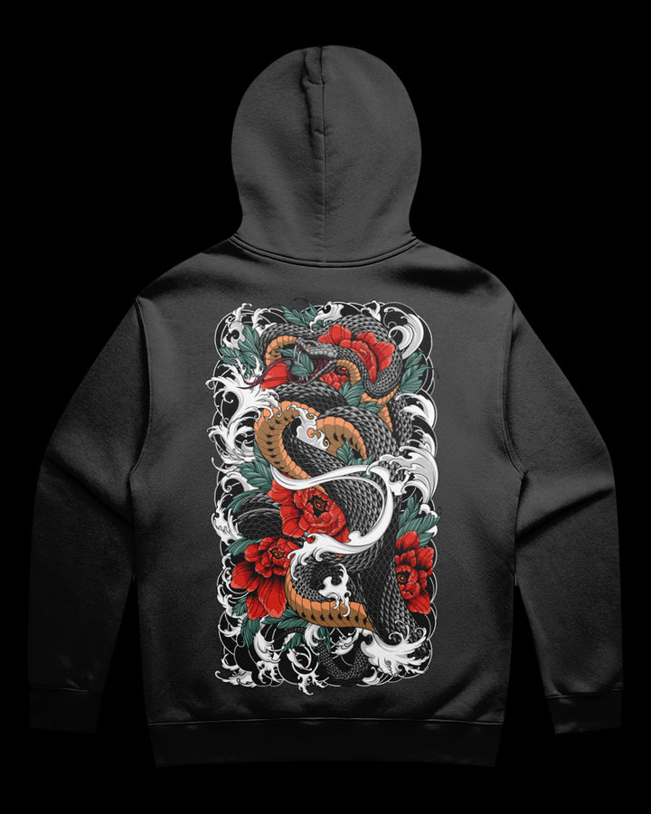 Black hoodie with a colorful snake and floral design on the back against a black background